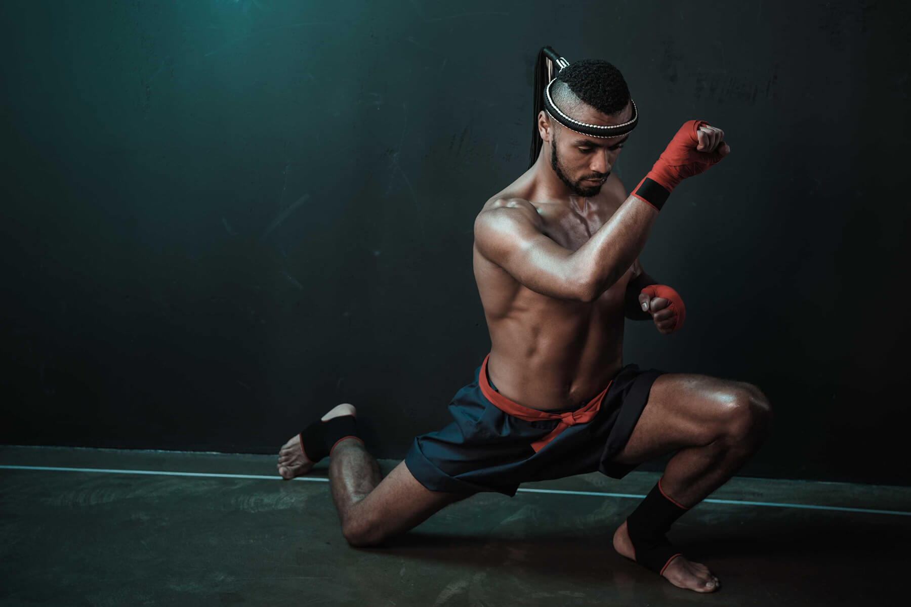 muay-thai-athlete-training-at-thai-boxing-indoors-HP3RAWL.jpg