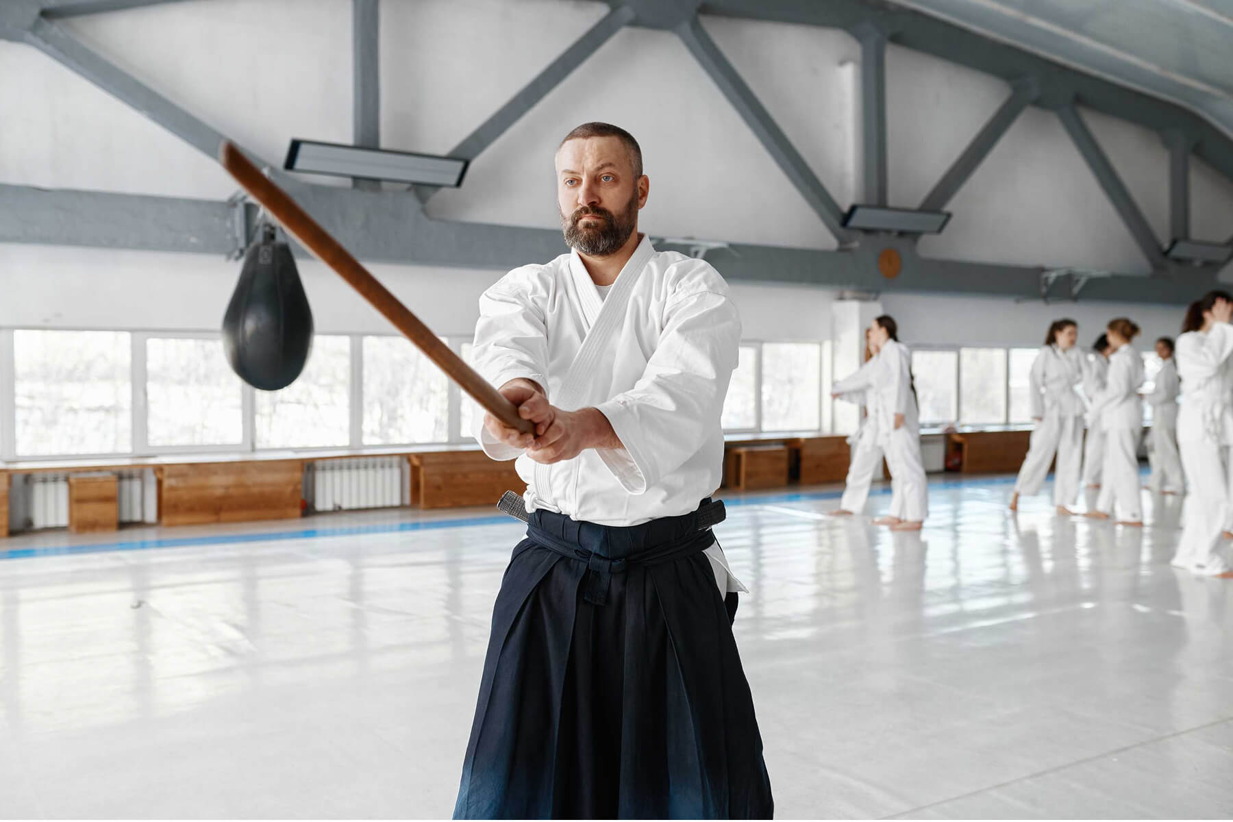 portrait-of-aikido-sensei-master-with-wooden-sword-9DT7NNN.jpg